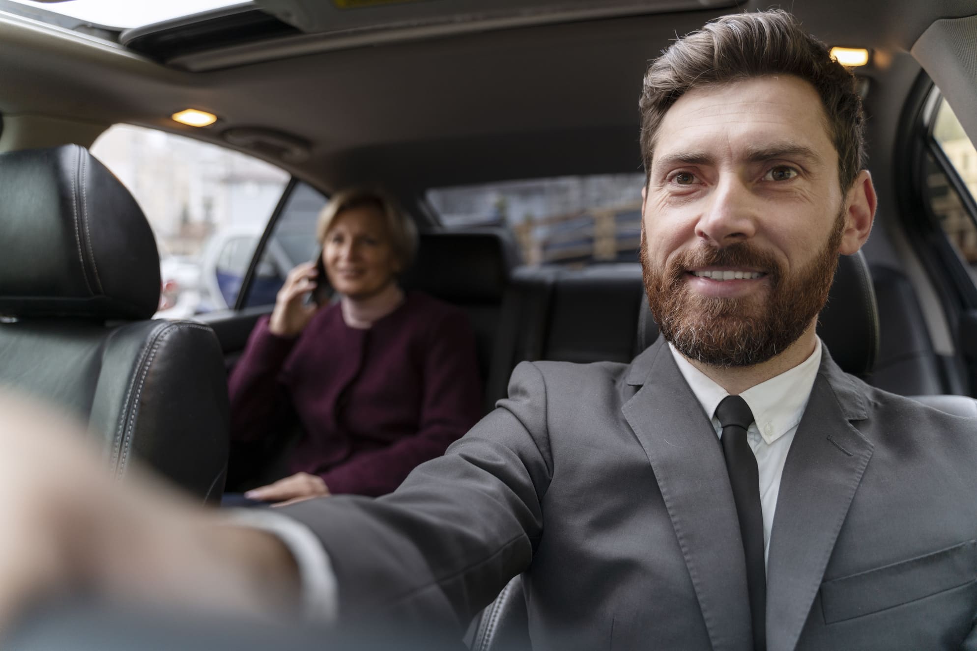 taxi-driver-female-client-interacting-formal-way (1) (1)